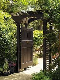 20 Amazing Garden Gate Ideas Which Make A Great First Impression In 2020 Garden Archway Garden Entrance Garden Doors