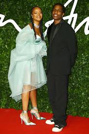 Rihanna dialled up the glamour of her summer dress with strings of dior beads, a fendi baguette and a fuchsia furry bucket hat similar to her beloved emma rocky, whose real name is rakim athelaston mayers, coordinated in a purple knitted tank and leather separates, with rih later shrugging his jacket. Asap Rocky Was Into Rihanna For Years Before They Started Dating