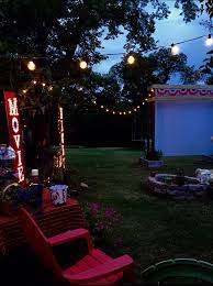Outdoor Movie Screen And Sign Backyard Movie Screen Backyard Movie Nights Backyard Movie