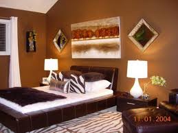This gold sheen accent wall creates a magnificent feeling as minimal color versatility will help create a calming master bedroom. A Touch Of Zebra Contemporary Africa Bedroom Color Schemes Mens Bedroom Colors Mens Bedroom