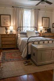 The focal point in the kitchen is the ivory wall with a sliding tribal carved barn door that evokes old world charm. Inspirational Farmhouse Bedroom Curtains Farmhouse Style Master Bedroom Small Master Bedroom Remodel Bedroom