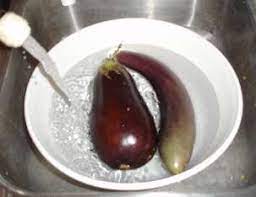 Start by trimming off the top and bottom of the eggplant, removing the stems and leaves. How To Freeze Eggplant Easily With Step By Step Photos Recipe Directions Ingredients And Costs