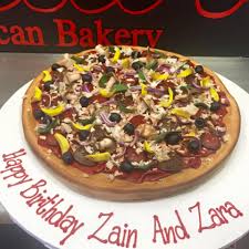 Pizza Birthday Cake When Your Pizza Pie Is Made Out Of Sugar And Cake That S Amore Specialty Cakes Food Bakery
