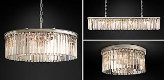 Walls, a bed and linen are gray. Chandelier Collections Rh