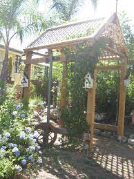 Pergolas Virginia Creeper Birdhouses And Windchimes A Great Way To Enter Our Home Backyard Fences Pergola Virginia Creeper