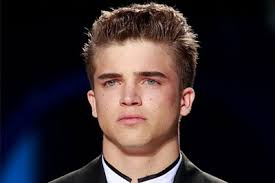 Short sides, a side part and height or angled fringe. Mens Hairstyles For Round Faces