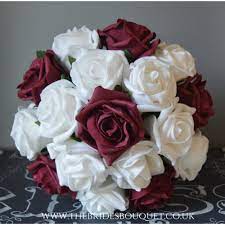 Here are some beautiful ideas we adore. Burgundy Ivory White Wedding Bouquet Posy Flowers Bridesmaid Bride Buttonholes Wedding Garland Patterer Wedding Flowers Petals Garlands