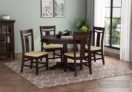 Come find the round glass dining table sets you are looking for. Buy Isadora 4 Seater Round Dining Set Walnut Finish Online In India Wooden Street