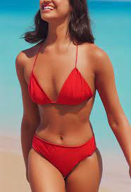 Midjourney prompt: AOC smiling wearing a red bikini at - PromptHero