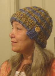 Cabled Hand Knit Wool Beanie With Button Tab