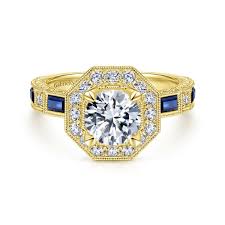 Approximately 1/3 carat total diamond and gemstone weight. Gabriel Bridal Art Deco 14k Yellow Gold Octagonal Halo Round Sapphire And Diamond Engagement Ring Hoovers Jewelers