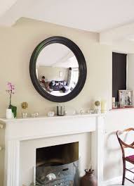 4 Essential Tips For Hanging A Round Mirror Above A Fireplace Omelo Mirrors Mirror Above Fireplace Living Room Mirrors Fireplace Mirror