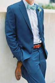 A Blue Suit A Light Blue Shirt A Mint Bow Tie And Ocher Shoes Groom Blue Suit Groom Wedding Attire Mens Wedding Attire