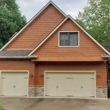A sectional garage door opens vertically like a standard door, but without kicking out like an up and over door. Carriage House Steel Doors Safe Way Door
