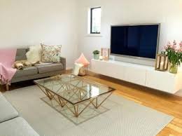 If you have no tables in your living space, reflect the color of your couch, chairs or accents. 10 Geometric Accent Tables That Ll Update Any Space To A New Level Living Room Tv Stand Living Room Tv Living Room Grey
