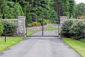 Iron Driveway Gate For A Small Driveway With A Simple Scroll Detail In The Middle The Custom Stone Driveway Gate Entrance Gates Driveway Driveway Landscaping