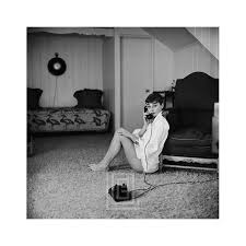 Mark Shaw Audrey Hepburn In White Blouse With Phone Leaning Against Chair 1953 Audrey Hepburn Audrey Hepburn