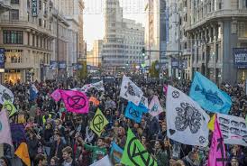 Extinction rebellion's new fashion act now campaign has released an open letter to the fashion industry, calling on it to remember promises made during the pandemic. Extinction Rebellion 2019 A Year To Remember