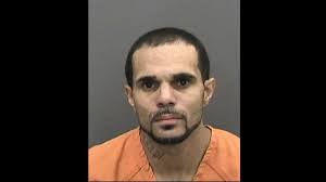 A body was found in Gibsonton. A man is now charged with murder, abusing  dead body.