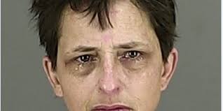 Woman arrested for stabbing roommate, spits