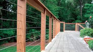 Drill holes through the deck to attach support posts with the long bolts. Renovating A Deck With Cable Rail Systems Fine Homebuilding