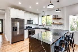 Dark cabinets don't have to be black—if the midnight mood isn't for you, consider a lighter shade of brown. White Kitchen Cabinets With Dark Countertops Designing Idea