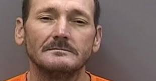 Suspect pulled from pond