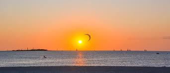 Sunset lake grass dawn sun water. Hd Wallpaper Sunset Ocean Beach Sea Kite Surfing Boat Landscape Noumea Wallpaper Flare