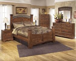 Queen Bedroom Furniture Signature Design By Ashley Timberline Queen Poster Bed Wayside In 2020 King Bedroom Sets Cheap Bedroom Furniture Bedroom Sets Queen