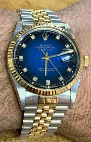 The watch has a rolex usa oval link jubilee bracelet. Rolex Datejust Gold Steel Blue Vignette Diamond Dial 16013 Jubilee Watchcharts