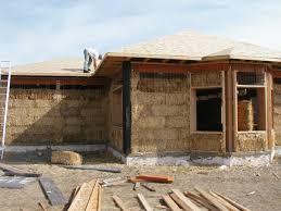 The posts are tree trunks with bark peeled off and the beams and rafters are rough sawn wood. Living Outside The Box Alternative Building Materials Give Homeowners More Options Thefencepost Com
