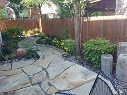 A flagstone patio with a fire pit is the perfect place where you can take a book and slowly read. Flagstone Patio Installation Fort Worth Hardscapes Arlington Dallas