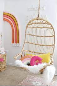 11 gorgeous hanging chairs you can buy 17 real spaces using them hanging rattan chair rainbow bedroom hanging chair