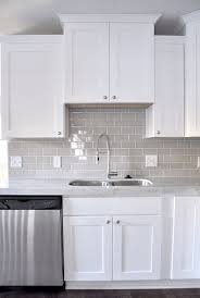 Gorgeous kitchen features white cabinets paired with white marble countertops and a white subway tiled backsplash. 21 Best Grey Backsplash Ideas In 2021 Kitchen Remodel Kitchen Design Kitchen Renovation