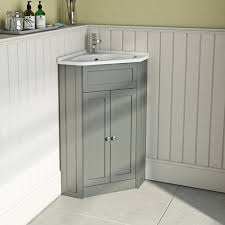 Some are floor standing whereas many are fixed to the wall to increase the floor area. The Bath Co Camberley Satin Grey Corner Floorstanding Vanity Unit And Ceramic Basin 580mm