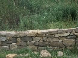 Faux stacked stone wall in performing to renovations to our plastic surgery office i really wanted to add a rock wall. Dry Stack Stone Retaining Wall At New Traditions Homestead Stone Landscaping Retaining Wall Stone Retaining Wall