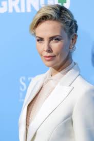 Charlize Theron in a white suit at the LA premiere of Gringo