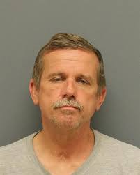 Man arrested, charged with breaking into business, stealing change, police  say