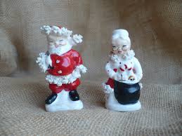 Claus are sneaking a quick kiss under the mistletoe! Santa Claus Salt And Pepper Shaker Mr And Mrs Claus Shaker Etsy Salt And Pepper Shaker Christmas Items Cow Creamer