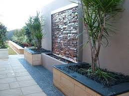 Fiber reinforced cast stone concrete construction proudly designed and manufactured in the united states no plumbing is needed; Water Feature And Landscaping Along Fence Backyard Landscaping Designs Water Feature Wall Outdoor Gardens Design