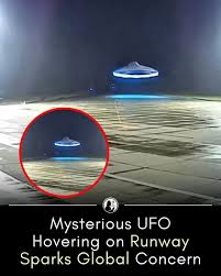 A spherical UFO was captured hovering silently over a runway, glowing with  an eerie blue light. Witnesses recorded the object, adding to claims that  alien probes could already be operating worldwide. Its