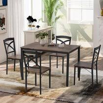 It's crafted from solid wood, with either an oak or walnut wood grain tone, and has a rounded surface set on four oval legs. 12 Person Dining Table Set Wayfair