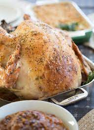 Garlic And Herb Mayonnaise Roasted Turkey Served For The Delightful Family Dinner Roasted Turkey Delicious Turkey Recipes Herb Roasted Turkey