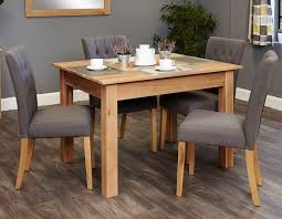 This amazing photos below is other parts of luxury modesty of grey dining room chairs content which is classed as within types and models. Baumhaus Mobel Oak Dining Table And 4 Grey Fabric Chairs Cfs Furniture Uk
