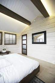 Recessed lighting on vaulted ceilings or sloped ceilings are a refined and classic accent in larger living spaces. 10 Indirect Lighting Ideas That Create A Stylish Home High Ceiling Lighting Ceiling Light Design Vaulted Ceiling Lighting