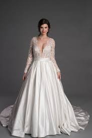 The wedding dress, designed by mirella and steve gentile, featured a sweetheart neckline, a fitted waist, a full skirt and long sleeves. Long Sleeve Ballgown With Lace And Plunging V Neckline Kleinfeld Bridal