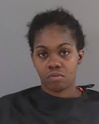 SCSO: Woman charged after attempting to hit victim while child in vehicle