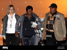 Edna Glover, mother of Henry Glover, center, exits federal court in New  Orleans, Wednesday, Dec. 11, 2013. A federal jury acquitted a former New  Orleans police officer of fatally shooting a man