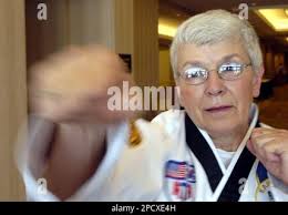 ADVANCE FOR SUNDAY, JUNE 25 ** Sally Burke, 64, of Cape Canaveral, Fla.,  warms up Thursday, June 22, 2006, before she tests for her fourth-degree  black belt and competes at the