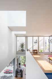 The living room of dinah and bill ruch's los angeles home, refurbished to reflect its 1940s william haines design, features a sectional sofa upholstered in mohair this trick can create seating areas that are better for conversation and helps keep the center of the room from feeling like an empty void. Block Void House Bundschuh Architekten Archdaily